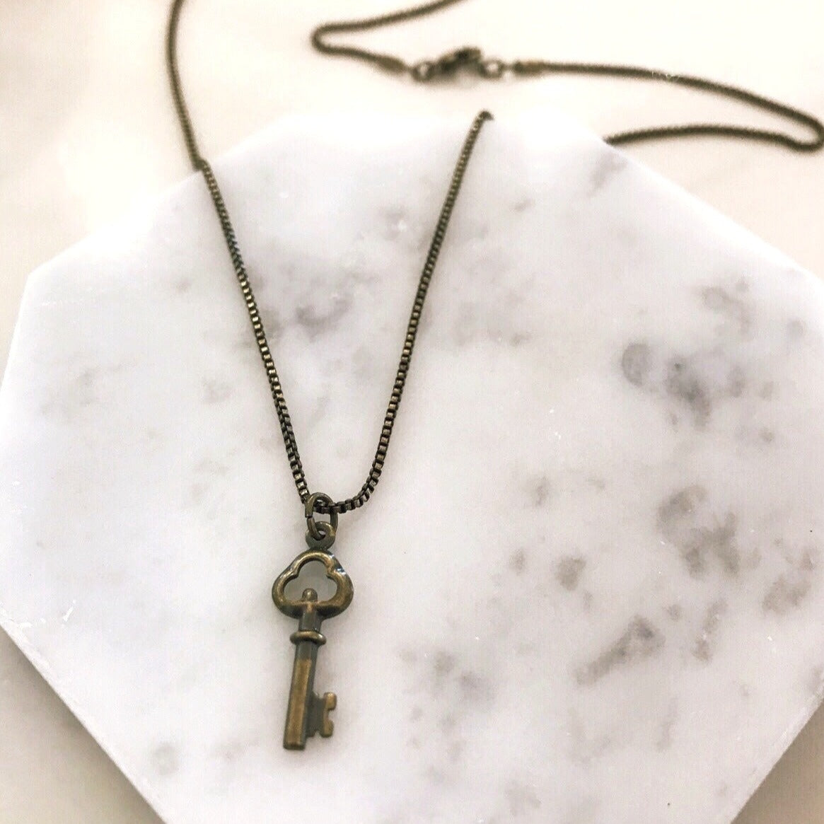 Long key best sale necklace